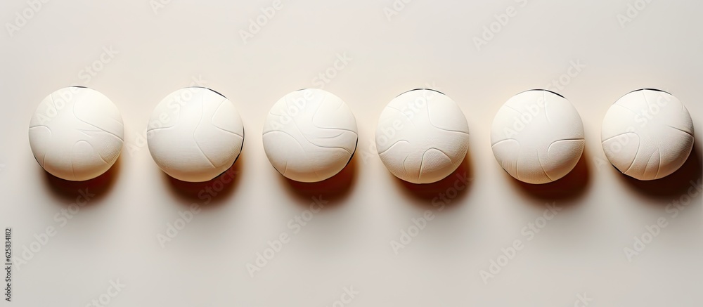Poster Photo of a row of white eggs on a table with plenty of space for your own message or design with copy space