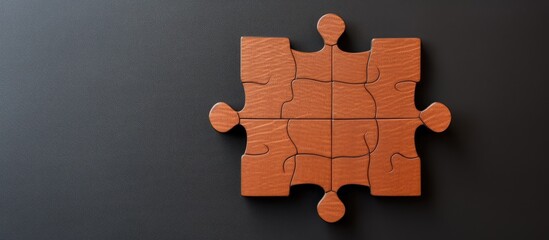 Photo of a puzzle piece placed on a table, ready to be assembled with copy space