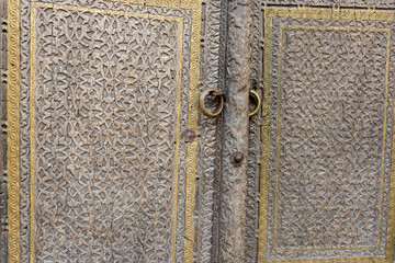 a wooden door with a ring on its knob