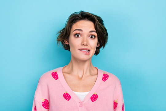 Photo of lovely pretty adorable girl wear pink trendy print outfit bite lips grimace oops sorry isolated on blue color background