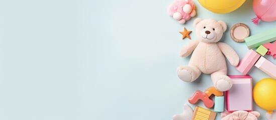 Photo of a cute teddy bear surrounded by colorful balloons and other party decorations with copy space