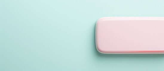 Obraz premium Photo of a pink soap bar on a vibrant blue background with copy space