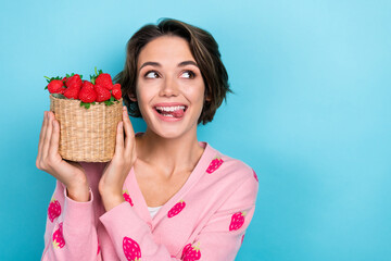 Photo of cheerful pretty girl stylish clothes presenting red delicious seasonal berries look empty...