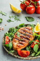 Roasted Chicken Fillet, green lettuce, arugula, tomatoes. Ketogenic diet. Low carb high fat breakfast. Healthy food concept. place for text, top view