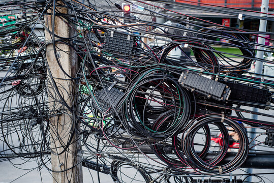 Untidy and cluttered wires and cables are installed.