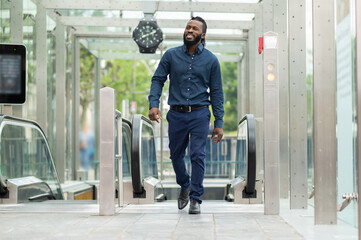 Young dark-skinned tall man in denim clothes looking confident