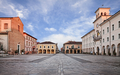 Cervia, Ravenna, Emilia-Romagna, Italy: the main square of the town on the Adriatic sea coast with the old town hall and the ancient cathedral
