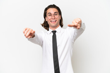 Business handsome man isolated on white background points finger at you while smiling