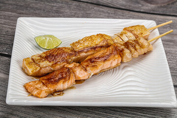 Grilled salmon skewer with sauce