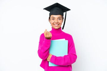 Young student hispanic woman holding a books isolated on white background making money gesture