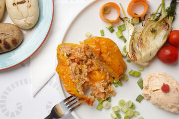 Very delicious Greek bell peppers with a simple rice filling served with cheese and vegetables