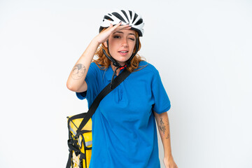 Young caucasian woman with thermal backpack isolated on white background looking far away with hand to look something