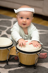 little girl playing the drum