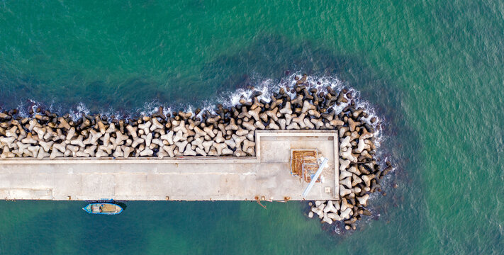 Aerial panoramic view from drone to the breakwater and pier