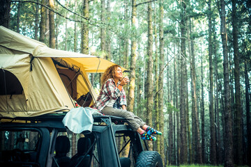 Adventure and travel journey lifestyle people using vehicle as hoem with roof tent on the car. One...