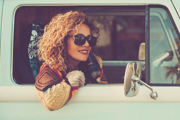 Travel with classic vehicle. One hapy tourist pportrait enjoying destination outside the window of...
