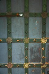 An architectural element of the decoration of an old wooden door. Close-up.