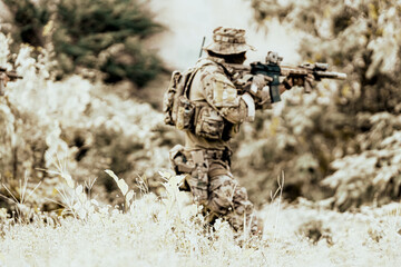 United States Army ranger during the military operation. Professional marine soldiers training with...