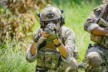 United States Army ranger during the military operation. Professional marine soldiers training with...