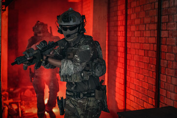 United States Army ranger during the military operation. Professional marine soldiers training with...