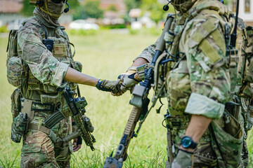 United States Army ranger during the military operation. Professional marine soldiers training with weapon on a military range.