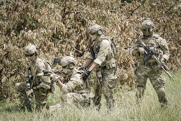 United States Army ranger during the military operation. Professional marine soldiers training with...