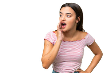 Fototapeta premium Young caucasian woman isolated on green chroma background whispering something with surprise gesture while looking to the side