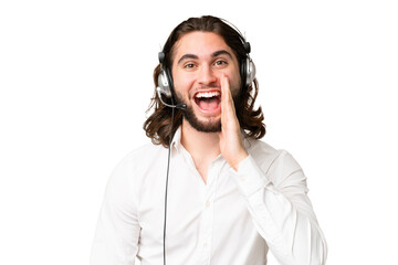 Telemarketer man working with a headset over isolated chroma key background with surprise and...