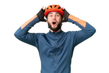 Young cyclist man over isolated chroma key background with surprise expression