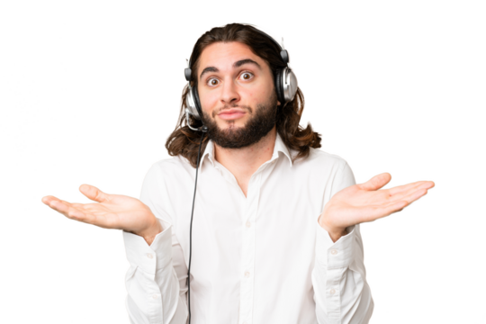 Telemarketer man working with a headset over isolated chroma key background having doubts while raising hands