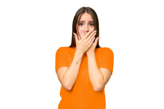Young pretty caucasian woman over isolated background covering mouth with hands
