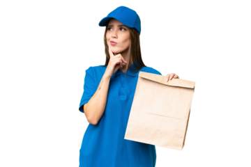 Young beautiful caucasian woman taking a bag of takeaway food over isolated background having doubts while looking up