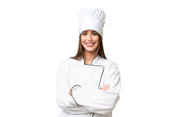 Young chef caucasian woman over isolated background keeping the arms crossed in frontal position