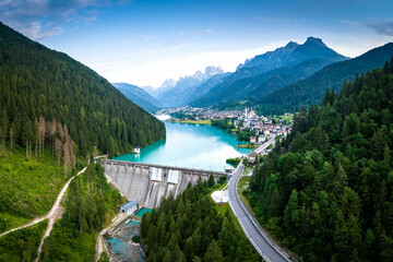 Auronzo di Cadore beautiful aerial panorama overlooking the dam and the lake and the magnificent Dolomites.