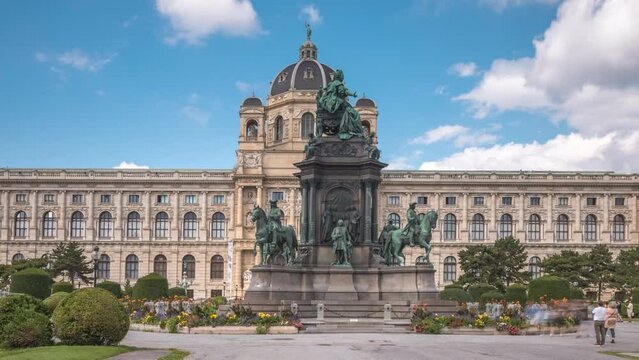 Vienna Empress Maria Theresia Monument timelapse hyperlapse and Museums Quartier on a background in Vienna, Austria. Famous Natural History Museum with park and sculptures near in Vienna, Austria