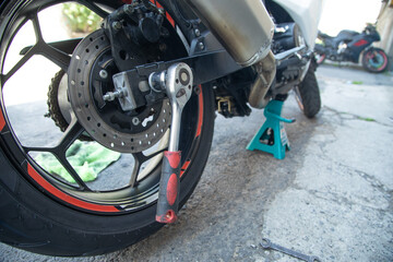  Wrench near the motorcycle vehicle. Maintenance, repair motorcycle