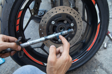 Changing the lubrication and cleaning the bearings of the motorcycle. Maintenance, repair motorcycle