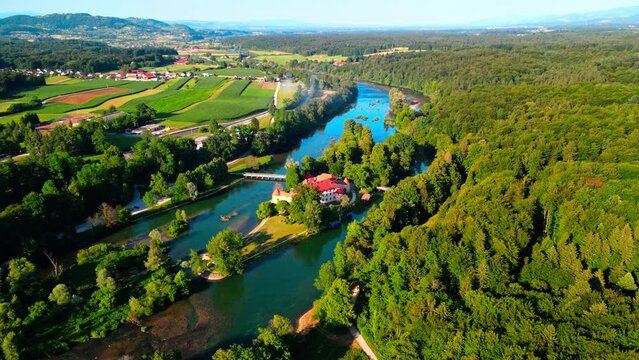Picturesque 4K drone footage of Castle Otočec in beautiful sunny light. Video shows this historic gem embraced by the Krka River. Captivating Slovenia's beauty from aerial perspective.