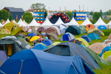 Colorful camping tents on field for event