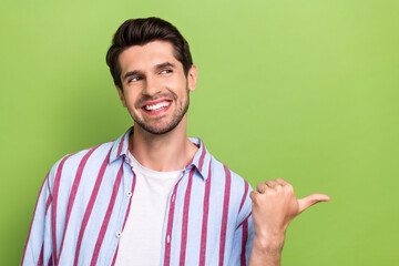 Portrait of satisfied pleasant person wear stylish clothes look directing empty space announcement...