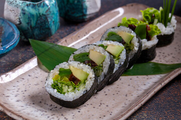 Sushi, delicious Japanese cuisine. Rolls of delicious sushi on a plate