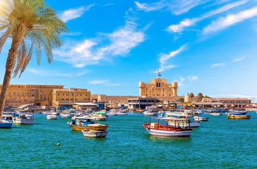 Fototapete Altes Gebäude Alexandria harbour, boats near Qaitbay fort, point of the famous lighthouse, Egypt