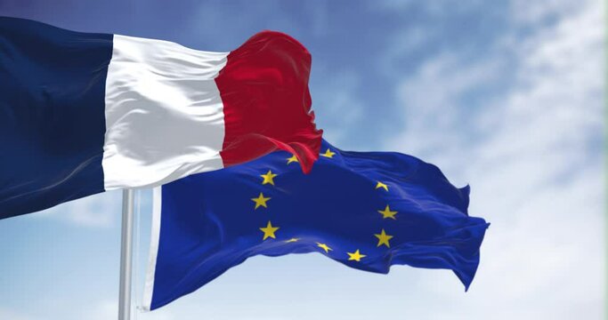 The flags of France and the European Union waving together on a clear day