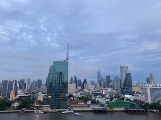 Fototapeta premium View from ICONSIAM shopping mall Saw many famous high-rise buildings in the center of Bangkok on a rainy evening in Thailand.This is the original image from the iPhone 11.