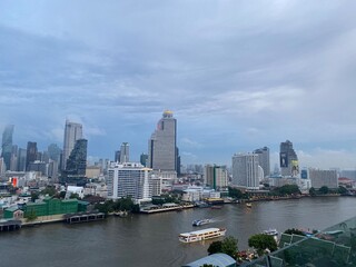 Fototapeta premium View from ICONSIAM shopping mall Saw many famous high-rise buildings in the center of Bangkok on a rainy evening in Thailand.This is the original image from the iPhone 11.