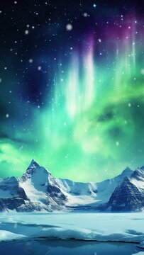Vertical video of aurora borealis over a snow mountain