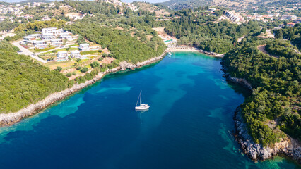 Aerial drone ultra wide panoramic photo of luxury sailboat anchored in tropical exotic island with...