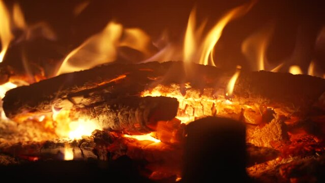 Burning firewood in the fireplace. Slow motion