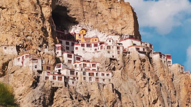 View of the Phugtal monastery built inside the mountain cave during the sunset near Purne in Zanskar Valley, Ladakh, India. Monastery built inside mountains in Zanskar. Remote monastery in India.