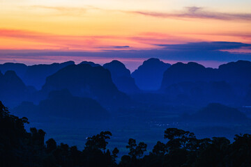 Colorful dusk over tropical hills - 625913589